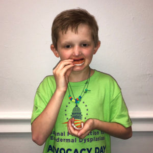 Young boy with dentures