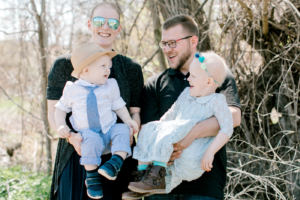Addison and her husband with their two children, one of which has Clouston syndrome.