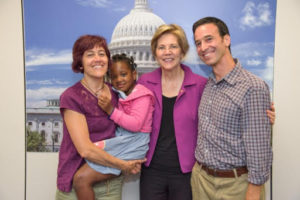 Maddie Weil and her parents pose for a picture with Senator Tammy Baldwin.