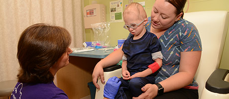Mom and child with nurse