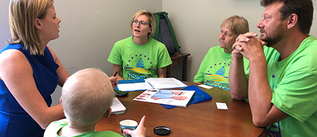A group of NFED members sitting around a table discussing ways to advocate