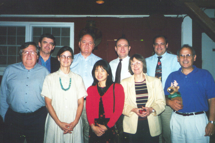 9 doctors and dentists stand in two rows to pose for a group photo of the NFED SAC.