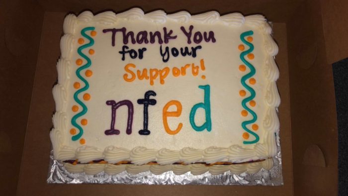 Sheet cake decorated in icing with the words, "Thank you for your support! NFED