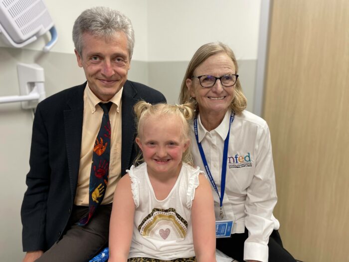 Dr. Holm Schneider from Germany and presenter at Grand Rounds, with patient, Ava, and NFED executive director, Mary Fete.