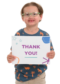 Child holding a sign that reads "Thanks you!"