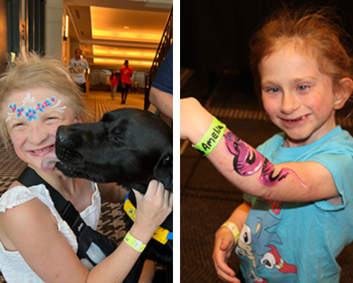 A girl with face painting of flowers on her forehead gets licked on the cheek by a black lab who is a canine support dog. In the second photo, a girl with teal shirt shows her arm which has a painting of a pink dragon on it.