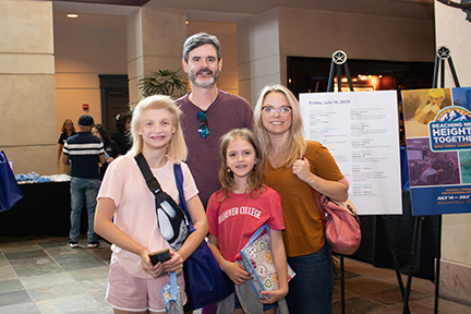 The Wiest family stands for a portrait at the NFED Family Conference. There is the father, mother and two children.